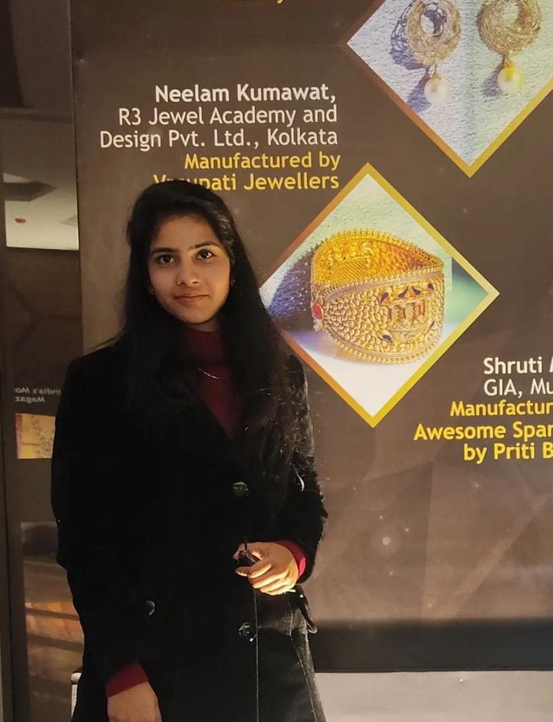 Neelam Kumawat of R3 Jewel Academy beside her exhibition board at the Jaipur Jewellery Show 2022